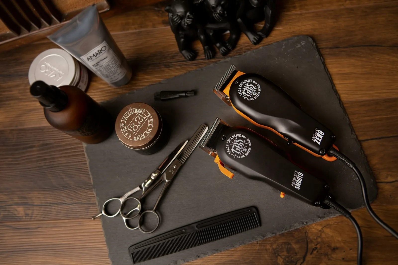 Scissors, clippers, and grooming essentials on a wooden counter — stock photography for this design concept